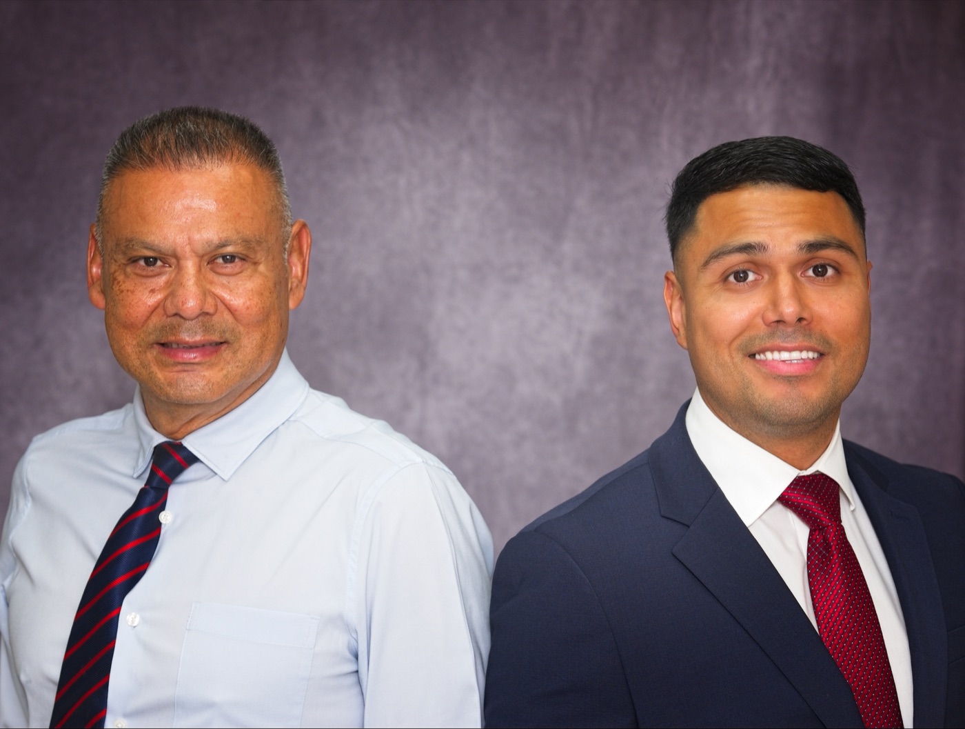Edwin Mejia Sr and Edwin Mejia Jr, the father-son attorneys of the firm, in professional portraits